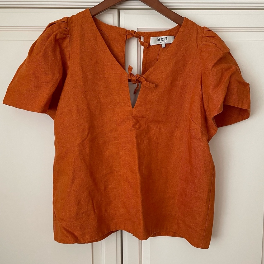 Sea open back linen top with puff sleeves in orange size 12